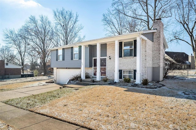 bi-level home featuring a garage