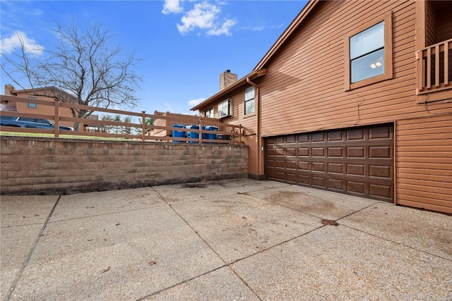 view of side of home with a garage