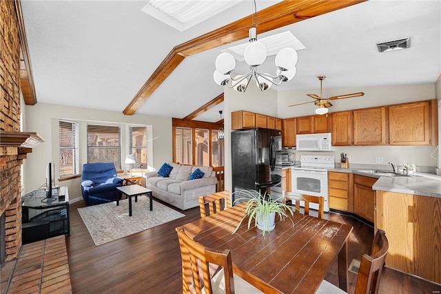 dining area with dark hardwood / wood-style floors, ceiling fan with notable chandelier, a fireplace, sink, and vaulted ceiling with beams