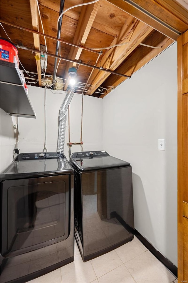 laundry area with washing machine and dryer