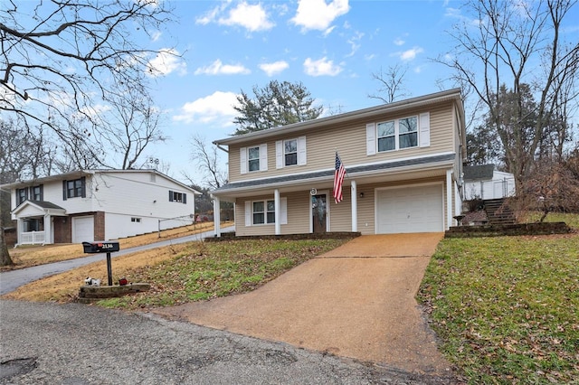 view of front of home with a garage and a front lawn