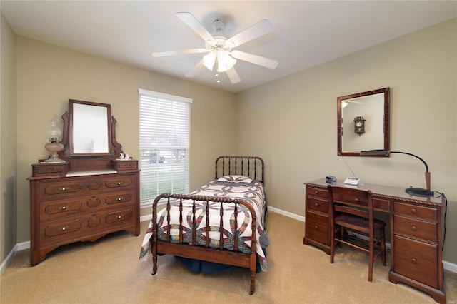 bedroom with light colored carpet and ceiling fan