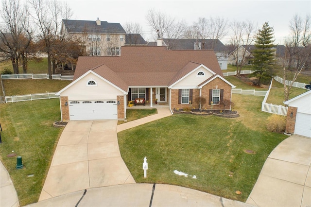 view of front of property with a garage and a front lawn