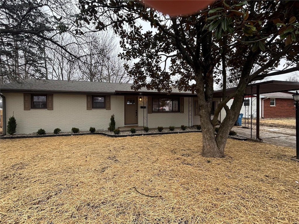 view of front of home with a carport