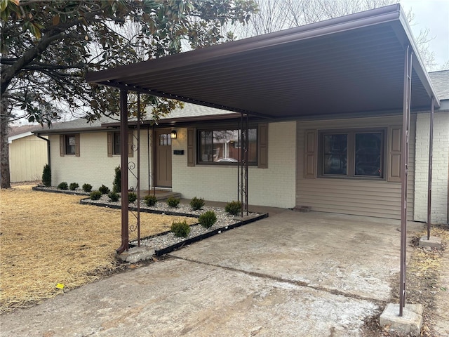 view of front of home with a carport