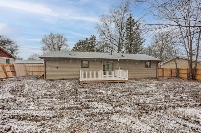 back of property with a deck