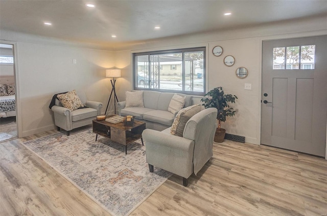 living room with light hardwood / wood-style floors