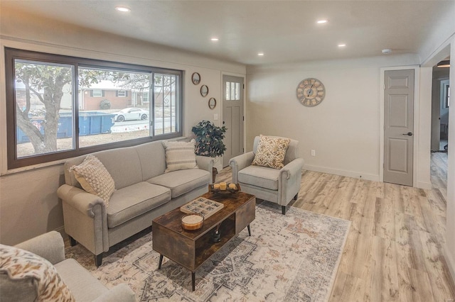 living room with light hardwood / wood-style flooring