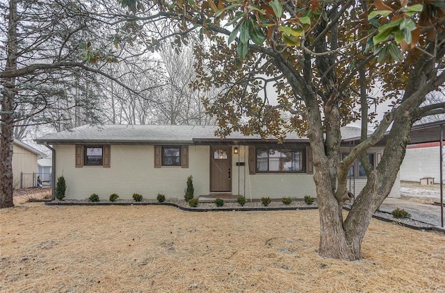 ranch-style home with a front lawn