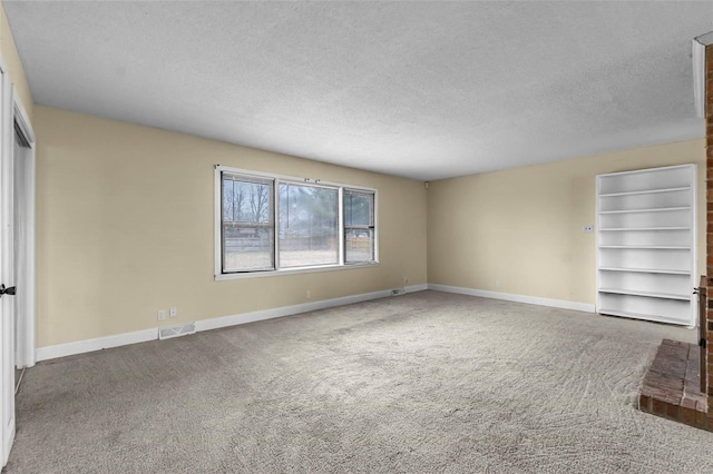 interior space featuring carpet, a textured ceiling, and a closet