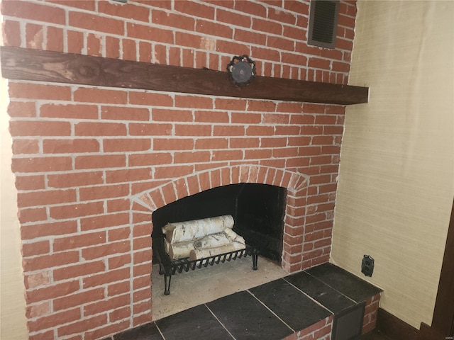 details with a brick fireplace