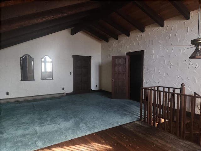 carpeted spare room featuring baseboard heating and vaulted ceiling with beams