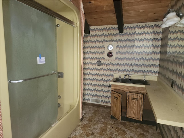 bathroom with vanity, bath / shower combo with glass door, wooden ceiling, and beamed ceiling