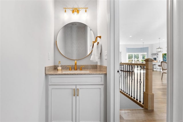 bathroom with vanity and hardwood / wood-style floors