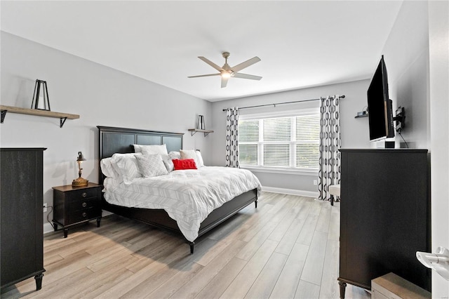 bedroom featuring ceiling fan and light hardwood / wood-style flooring