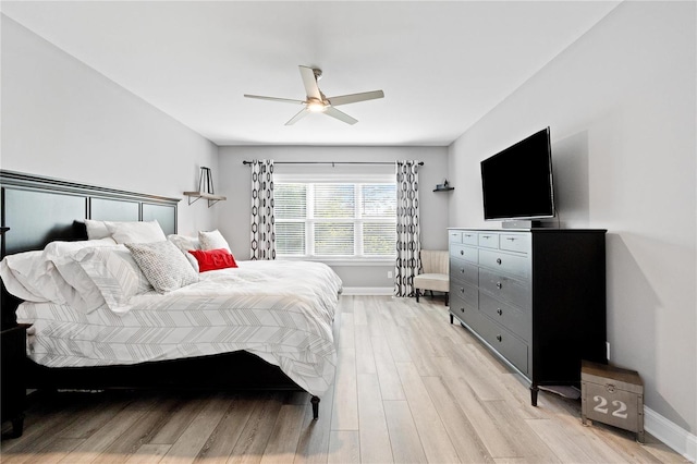 bedroom featuring light hardwood / wood-style flooring and ceiling fan