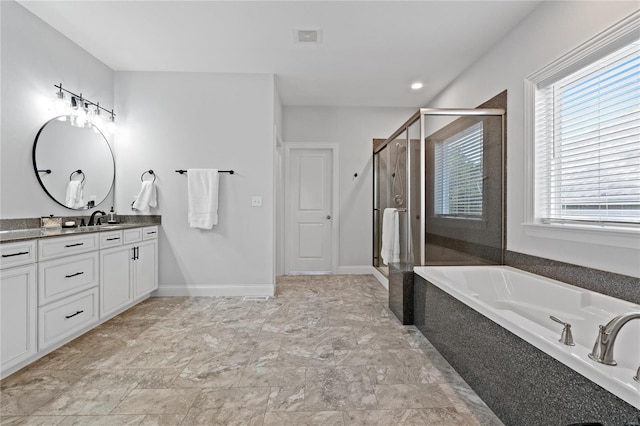 bathroom with vanity and independent shower and bath