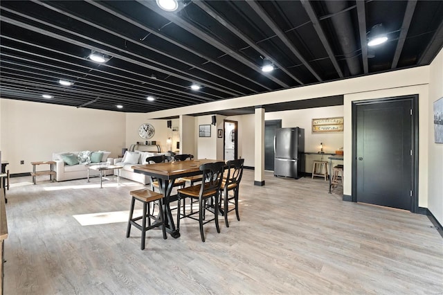 dining space featuring light hardwood / wood-style flooring