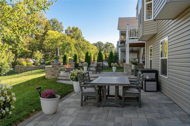 view of patio featuring a balcony