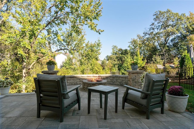 view of patio / terrace with an outdoor fire pit