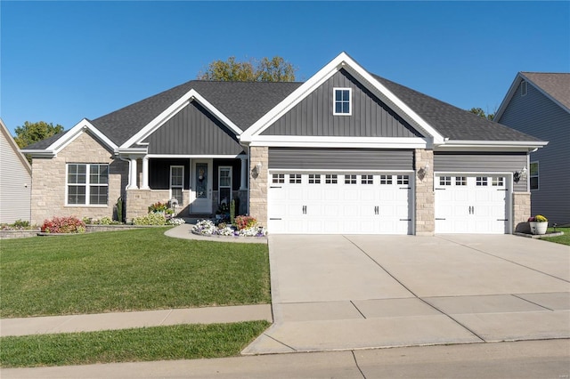 craftsman house with a garage, a front lawn, and a porch