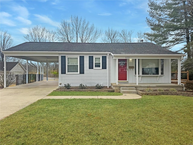 view of front of house featuring a carport, covered porch, and a front lawn