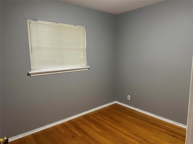 empty room with wood-type flooring