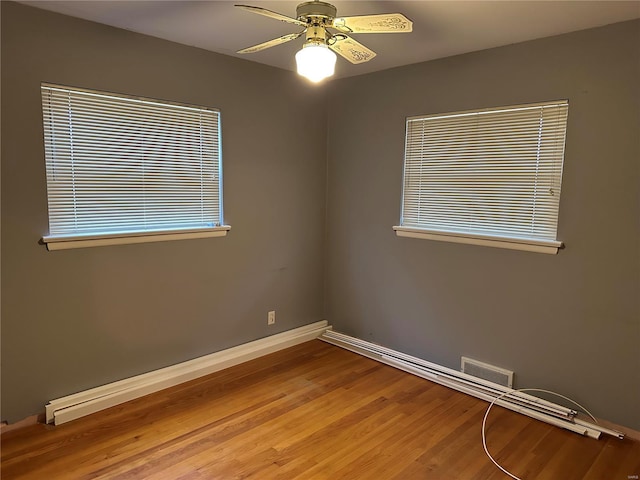 spare room with ceiling fan and light hardwood / wood-style floors