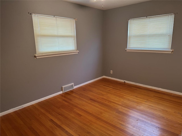 spare room featuring light wood-type flooring