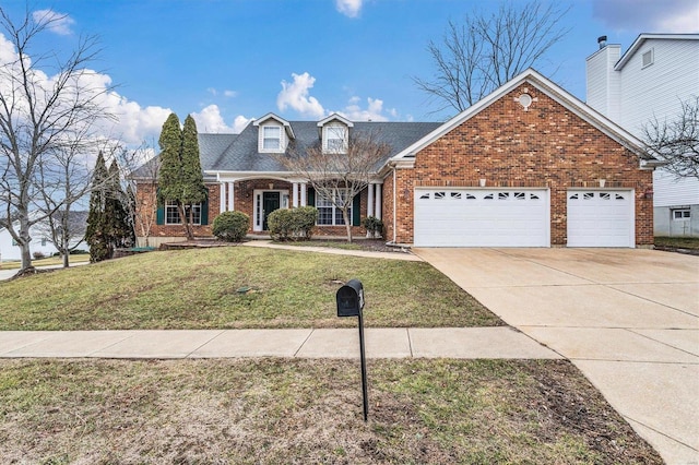 view of front of home featuring a garage and a front yard