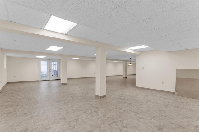 basement featuring a drop ceiling