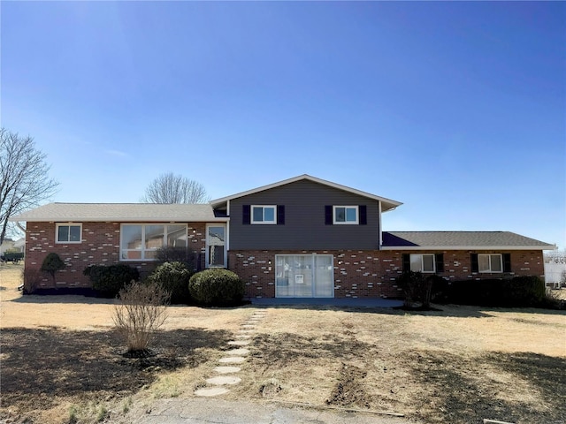 tri-level home with brick siding