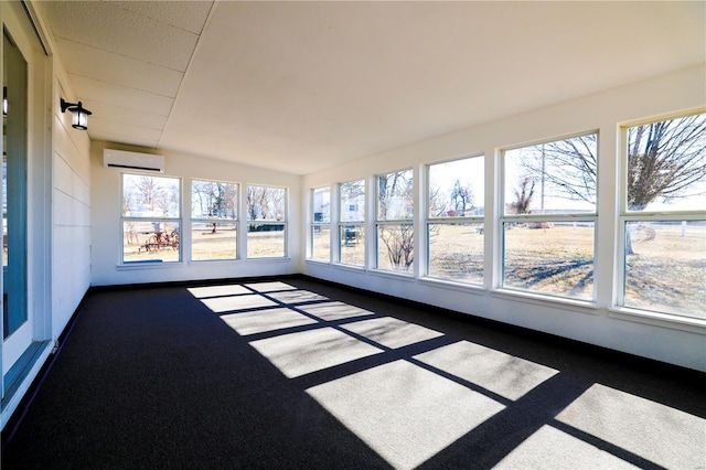 unfurnished sunroom with a wall mounted air conditioner