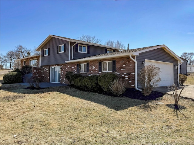 view of front of property featuring driveway, a front lawn, brick siding, and an attached garage