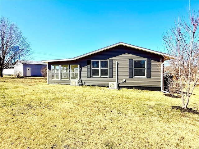 view of front of property with a front lawn and a sunroom