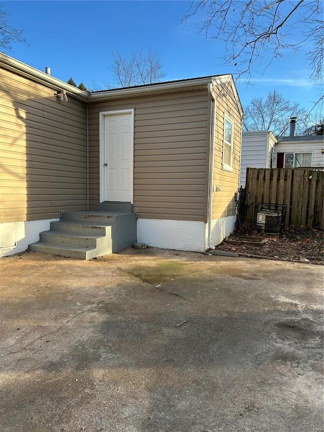 property entrance with fence