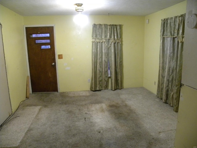 entrance foyer featuring light carpet