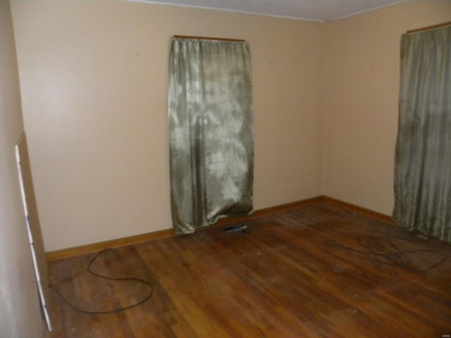 empty room featuring wood-type flooring