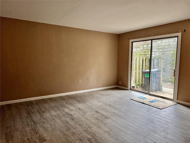 spare room with wood-type flooring