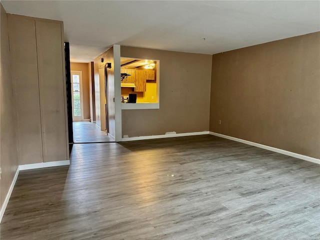 spare room with hardwood / wood-style floors