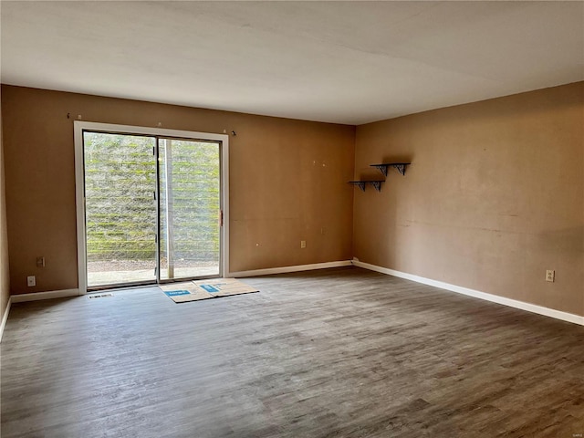 unfurnished room featuring dark hardwood / wood-style flooring