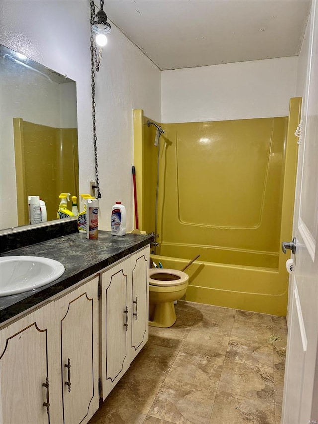 full bathroom featuring vanity, toilet, and bathing tub / shower combination