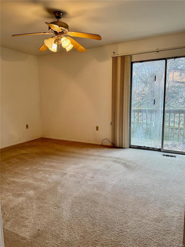 carpeted empty room with ceiling fan