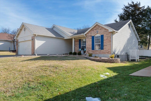 single story home featuring a garage and a front yard