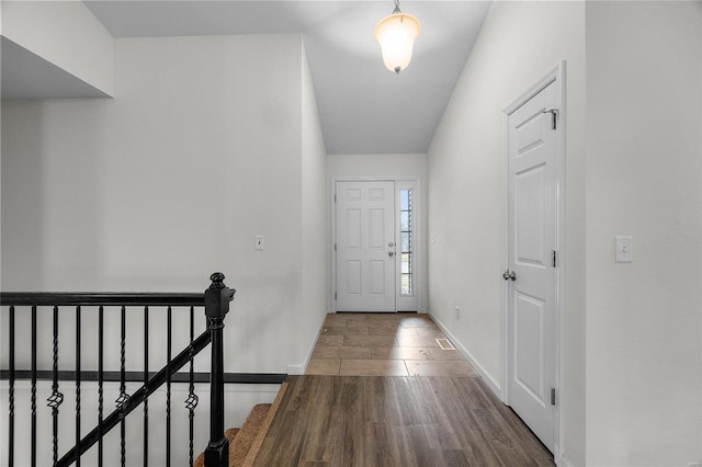 foyer entrance featuring wood-type flooring