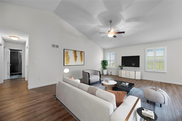 living room with dark wood-type flooring, ceiling fan, and high vaulted ceiling