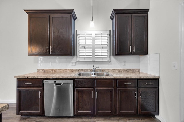 kitchen featuring sink, backsplash, hanging light fixtures, and dishwasher