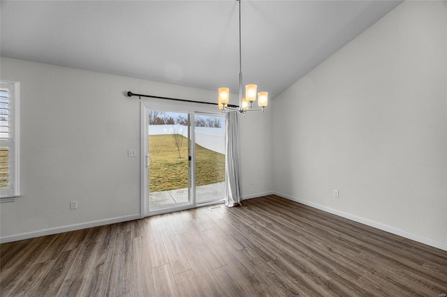 unfurnished dining area with dark hardwood / wood-style floors and an inviting chandelier