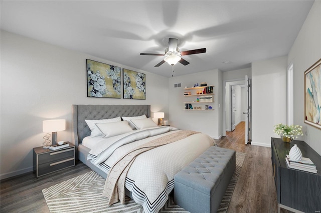 bedroom featuring dark hardwood / wood-style floors and ceiling fan