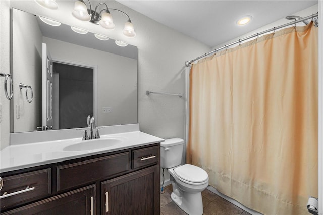 bathroom with vanity, curtained shower, tile patterned floors, and toilet